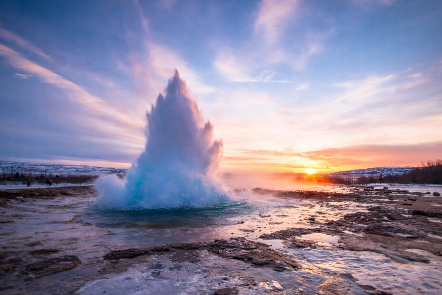 Strokkur geyser erupting at Geysir geothermal area in Iceland